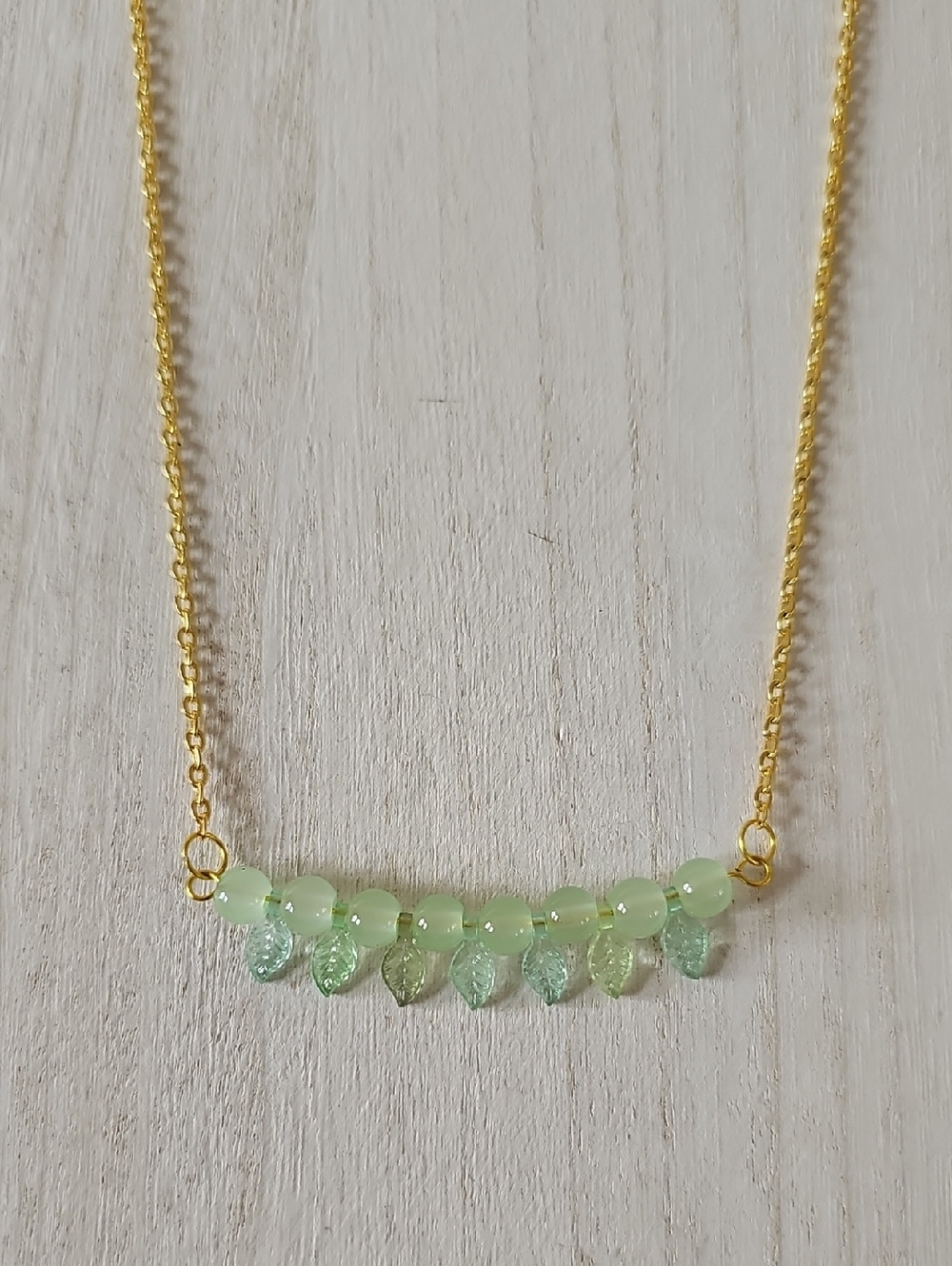 Delicate Gold Chain Necklace with Light Green Beads and Leaf Charms